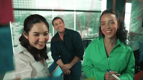 Professional business team brainstorming marketing idea by using sticky notes to share creative idea at glass wall. Group of diverse business team discuss about strategy. Closeup. Manipulator. - Powered by Shutterstock - Get 15% off with code: PIKWIZARD15