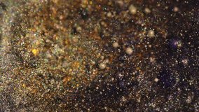 Golden glitter particles shimmer in macro close-up - Powered by Shutterstock - Get 15% off with code: PIKWIZARD15
