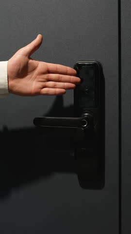 Businessman opening smart lock door using digital keypad