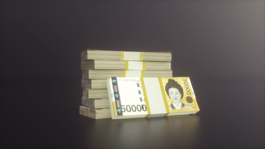 Stacks of South Korean Won Banknotes on Dark Background With Soft Light