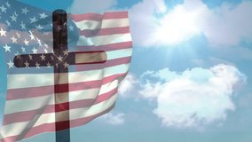 Light breeze picking up flag around cross, billowing red white stripes while clouds drifting behind. Patriotism, spirituality, outdoor, symbolism, movement, serenity, faith - Powered by Shutterstock - Get 15% off with code: PIKWIZARD15