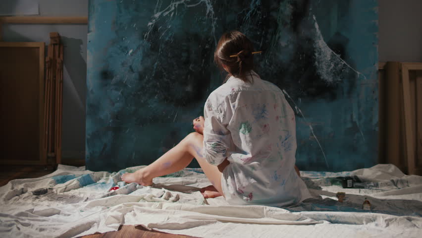 An Artist Paints a Large Abstract Artwork in His Studio, Using Art as a Tool for Personal Growth and Self-Development. Connection Between Creativity and Mental Well-Being Through Artistic Exploration