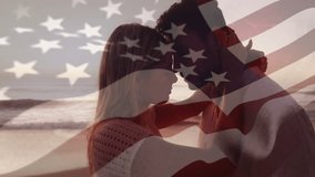 Travel ad showing romantic couple embracing touching foreheads as drifting US flag overlay on beach. Romance, intimacy, beach, sunset, serenity, love, nature - Powered by Shutterstock - Get 15% off with code: PIKWIZARD15