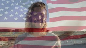 Businessman in dunes watching US flag overlay appearing rippling then fading revealing smiling face. Patriotism, outdoor, serenity, modern, landscape, resilience, independence - Powered by Shutterstock - Get 15% off with code: PIKWIZARD15