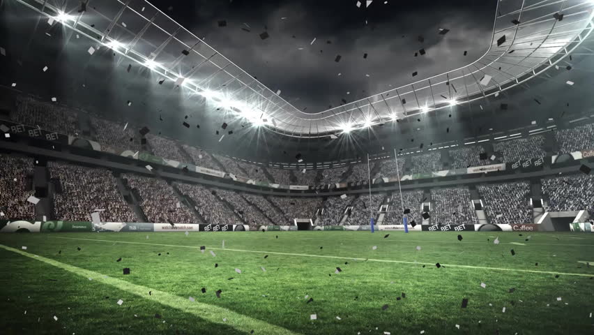 Floodlights sending confetti into stadium field, drifting under beams, marking victory. Celebration, victory, sports, architecture, illumination, festive, exuberance