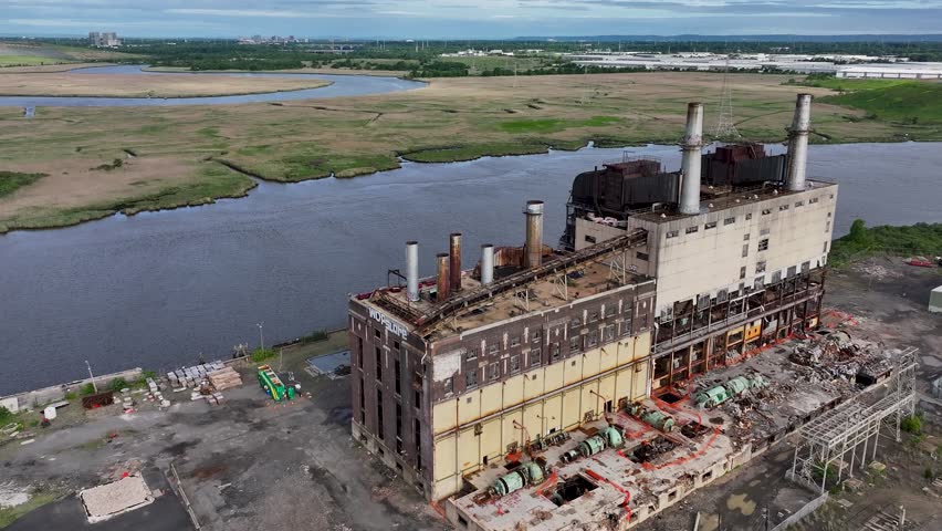 Aerial view of the demolition of an old coal burning power plant in Sayreville, New Jersey