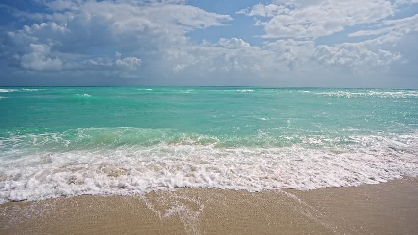Sea beach sand. Scenic sea beach backdrop. Paradise ocean view. Foamy ocean background. Exotic ocean. Open sea beach horizon. Relaxing waves. Summer background.