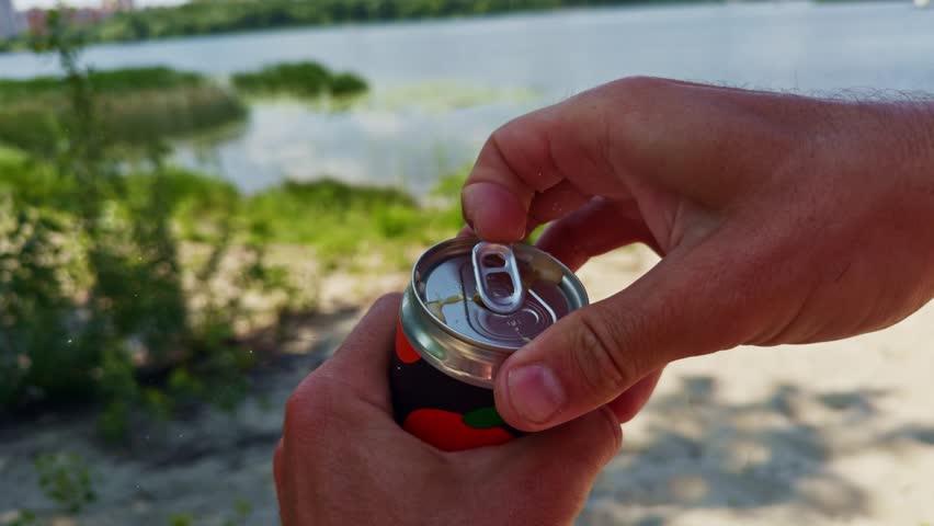 Opening Can With Soda Water. Hand Open Can Cold Carbonated Water. Splash Of Soda Water. Cold Sweet Drink In Recycle Bottle.Opening Beverage Cola Drink Bottle. Refreshment Drink In Steel Bottle Tin Can