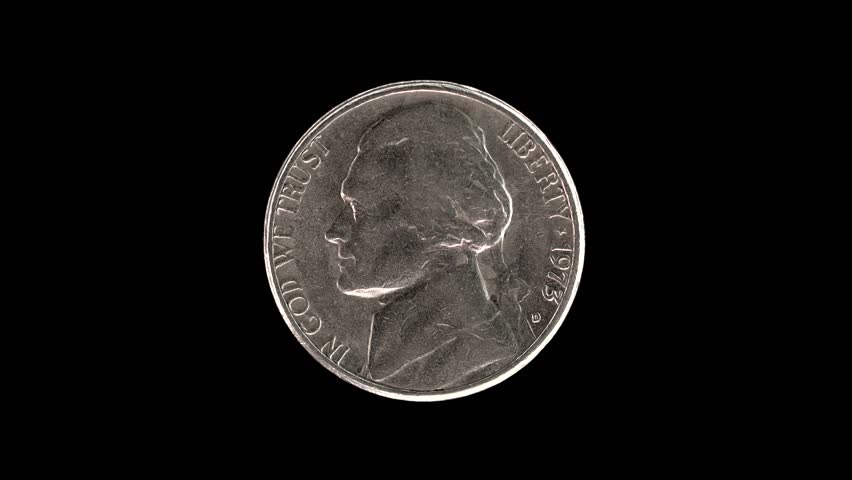 United States 1973 5 cent coin obverse with Thomas Jefferson first portrait rotating on black background