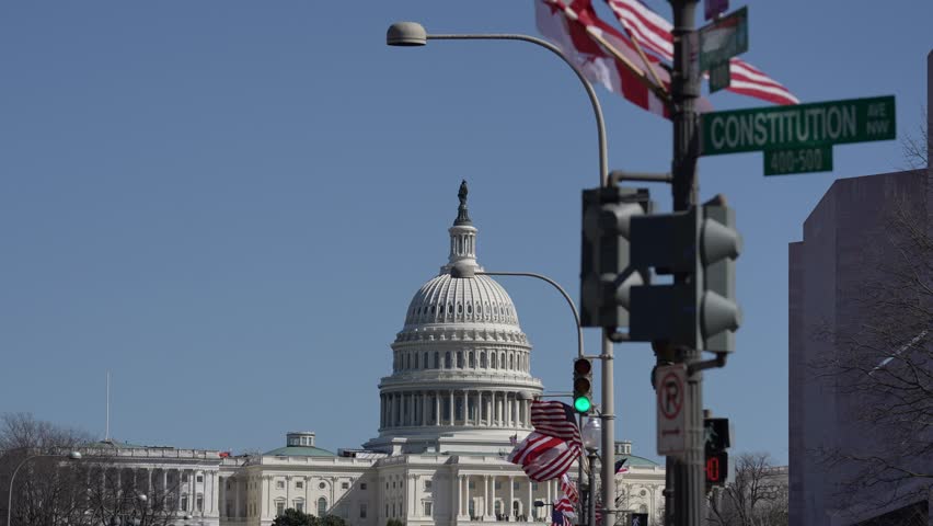 American construction flag waving. American construction at Capitol. Capitol in Washington DC. American construction site in Capitol. Construction and democracy in action. Vote and elect in America.