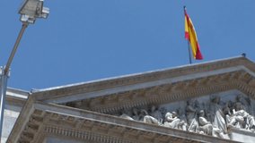 A red ceremonial banner hangs beside the name of Spain’s lower house, blending tradition, authority, and architectural splendor. - Powered by Shutterstock - Get 15% off with code: PIKWIZARD15
