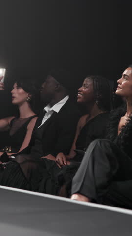 Woman, audience and fashion show at runway event as designer, clothes collection and label launch. Smile, stylist and crowd with model on stage for luxury brand, showcase outfit and gala performance