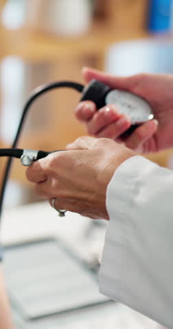 Hands, doctor and person with blood pressure, pump and assessment for hypertension at hospital. People, medical equipment and support for wellness, exam or monitor with service for patient at clinic