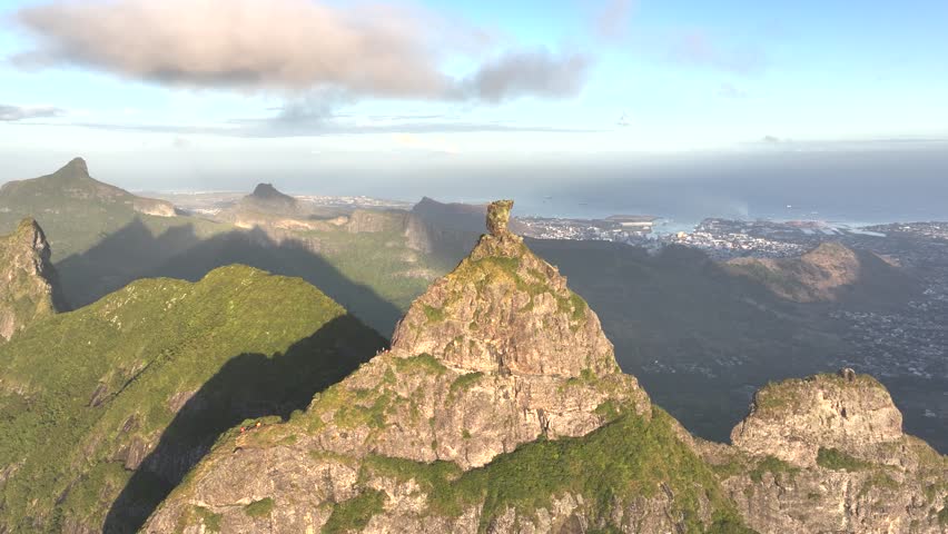 Aerial view of majestic Pieter Both mountain with lush green terrain under a dramatic sky, Port Louis, Mauritius.