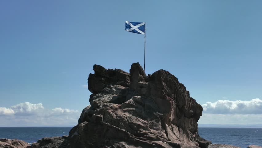 Scottish flag blowing in the wind at Anstruther beach East Neuk of Fife