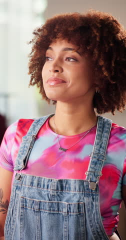 Fashion, face and woman with afro, smile or customer with trendy clothes in boutique, pride or bold. Happy, trendsetter and person with stylish outfit in store, consumer and confident in shop or USA