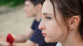 Boy with mother eating apple slices at healthy picnic, enjoying fresh snack. Male with woman eating apple slices during outdoor meal, savoring natural treat. Guy with mother eating apple slices at - Powered by Shutterstock - Get 15% off with code: PIKWIZARD15