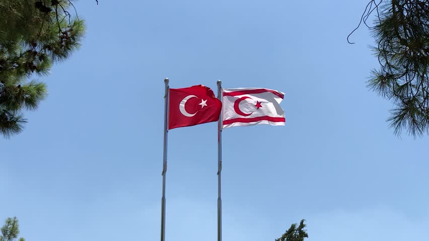 Türkiye and Northern Cyprus flags waving