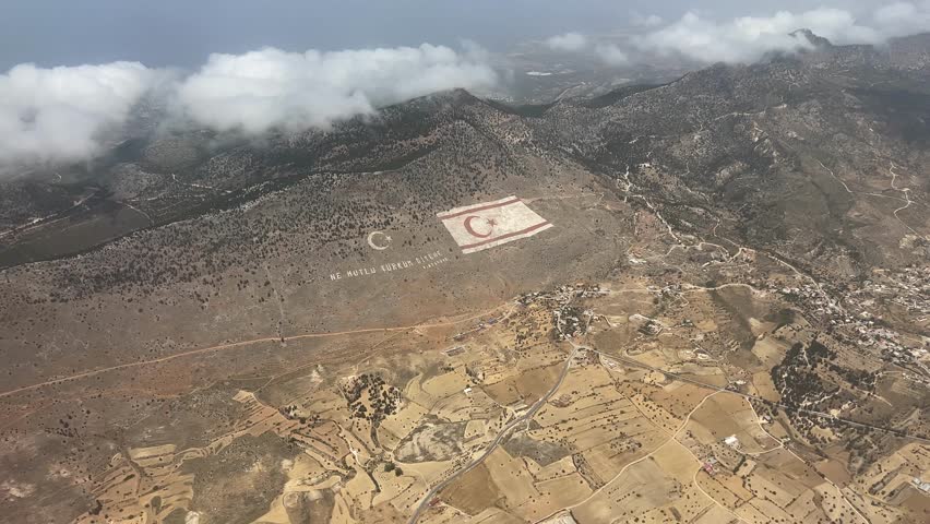 The giant TRNC flag in the Beşparmak Mountains of Northern Cyprus, shot from an airplane