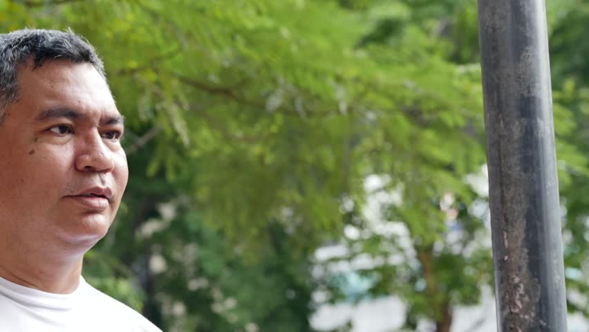 unlucky careless old senior man hitting his head with iron pole, concept of bad day, unlucky happenings, head injury, head accident, brain injury, real southeast asian senior man model