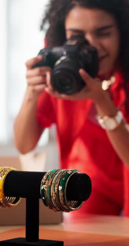 Woman, photographer and camera with jewelry for online marketing or advertising at home boutique. Female person, fashion designer or producer with lens for small business, startup or product showcase