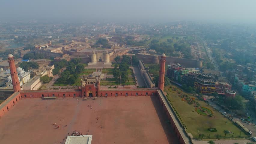 Aerial view of Lahore Fort, Badshahi Masjid and Old City with scenic greenery and historic architecture, Lahore, Punjab, Pakistan.