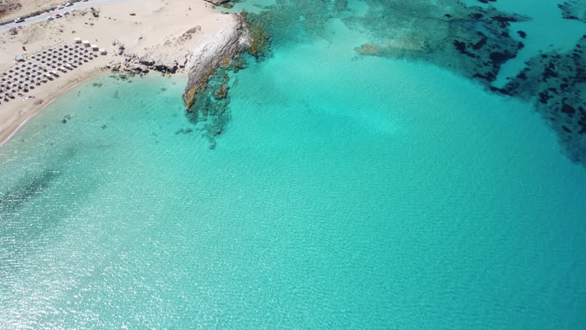 Aerial top view Falassarna beach in Crete, Greece, Falassarna beach is a very famous tourist destination in Crete, 4k aerial view beach. Famous Falasarna (also known as Falassarna or Phalasarna).