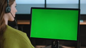 Corporate employee work green computer closeup. Office chroma key equipment. Unknown contact center operator manager talking headset check mockup screen at workplace. Call operator use template device - Powered by Shutterstock - Get 15% off with code: PIKWIZARD15