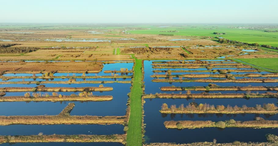 Aerial view of nature reserve Rottige Meente with beautiful wetland, peaceful peat bog, and scenic fields, Weststellingwerf, Friesland, Netherlands.