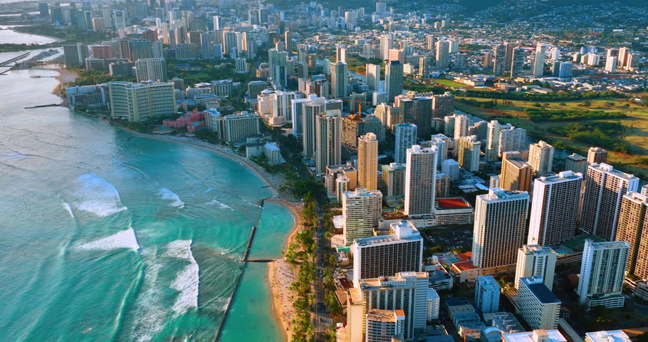 Aerial view of Waikiki beach with luxury resorts and palm trees, Honolulu, Hawaii, united states. Panorama of the city at sunset with luxury hotels on the waterfront.
