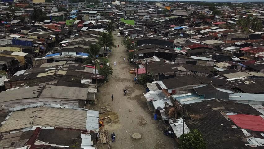 Aerial flying back over the Humanitarian Space Puente Nayero in Buenaventura, Colombia