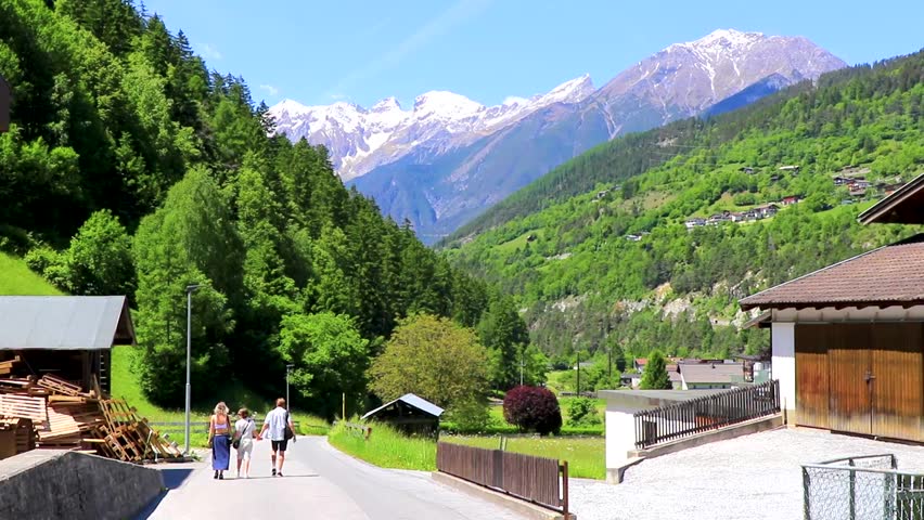 Landeck Tyrol Austria 30. May 2025 Mountain and alpine hill landscape mountains and peaks panorama of Lechtal alps and village town forest huts houses streets and blue sky in Austria.