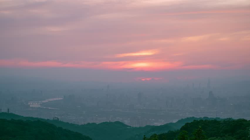Breathtaking sunset with orange hues over Taipei, viewed from Datong Mountain in Taiwan, captured on May 8, 2025.