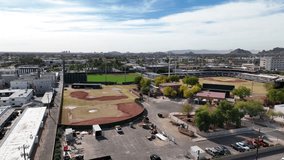 Aerial view of scottsdale stadium with baseball field and urban landscape surrounded by mountains and palm trees, scottsdale, arizona, united states. - Powered by Shutterstock - Get 15% off with code: PIKWIZARD15