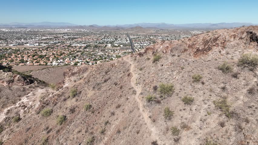Aerial view of lookout mountain with rocky terrain and cityscape in the background, Phoenix, Arizona, United States.