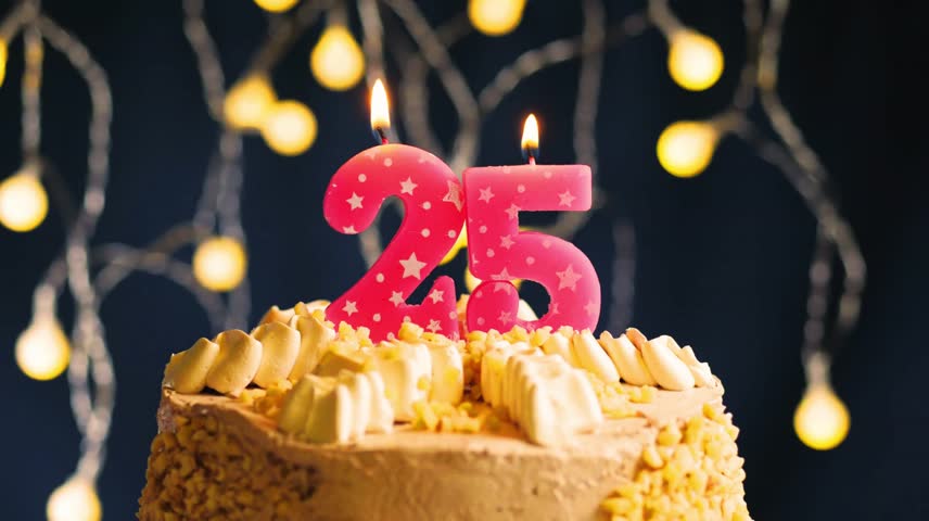 Elegant 25th birthday celebration with a pink number 25 candle on a frosted cake. Captured in slow motion as the candle is blown out, set against a vibrant lighting background 