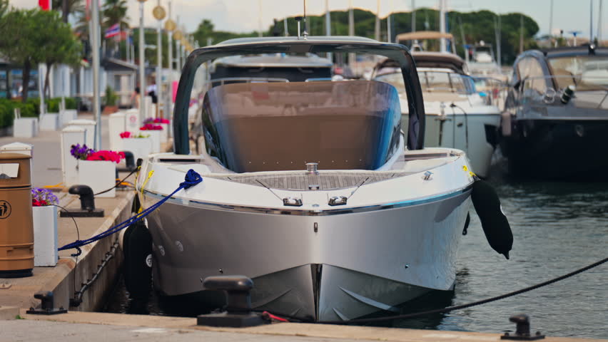 Close up of a boat docked in Port Vauban in Antibes, France in the evening
