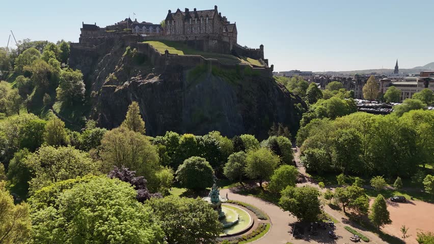 Aerial footage of Princes Street Gardens and Edinburgh Castle, Scotland