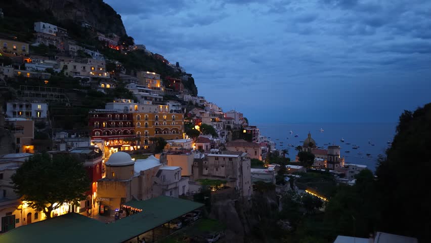 Aerial shot of Positano night lights on Amalfi Coast, Italy