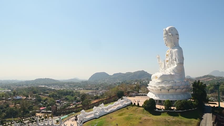 Chiang Rai, Thailand - 2023: Wat Huay Pla Kang sits on mountain top surrounded by an array of green hills in the heart of Chiang Rai.