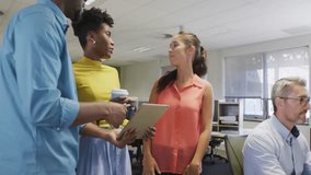 Three colleagues scrolling tablet in business office, showing animated social media metric rise. Collaboration, teamwork, innovation, digital, technology, analytics, communication - Powered by Shutterstock - Get 15% off with code: PIKWIZARD15