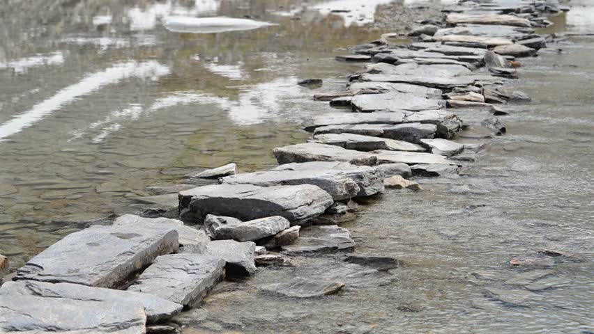 Beautiful hiking trail across reflection lake in the Alps - Col de la Vanoise in the French Alps