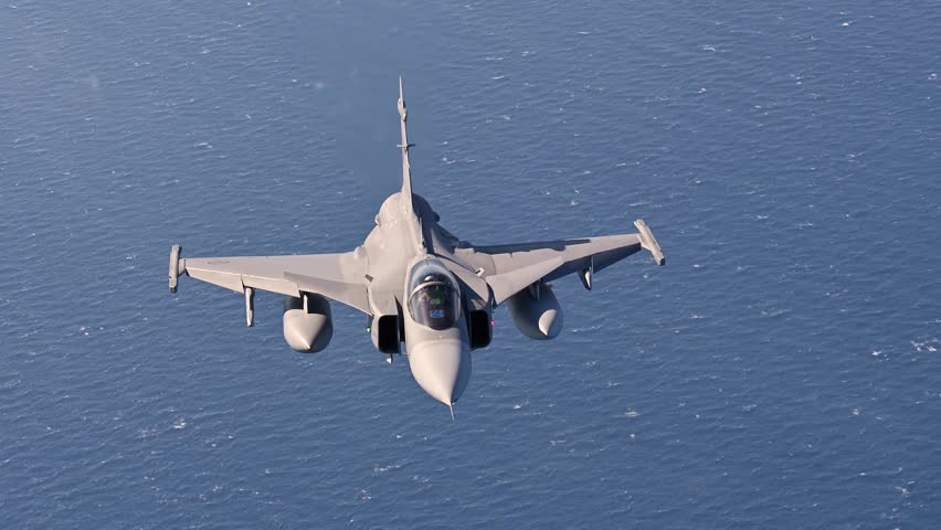 Saab JAS 39 Gripen fighter jet Flying in a Calm Position Over the Ocean.