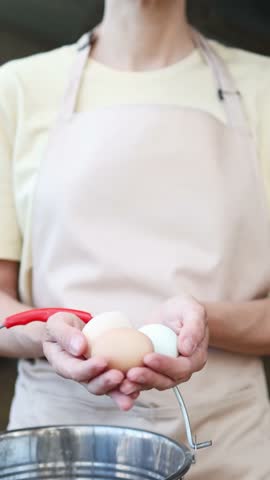 Farmer showing fresh organic eggs in slow motion