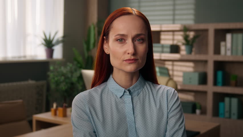 Serious business woman face girl Caucasian businesswoman look through magnifier vision test investigator scientist spy looking with magnifying glass big zoomed eye searching analyzing investigating
