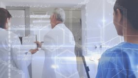 After case discussion doctors walking with tablet data while nurse jotting notes in corridor. Medical staff, healthcare, clinical team, digital technology, diagnostics, professional environment, - Powered by Shutterstock - Get 15% off with code: PIKWIZARD15