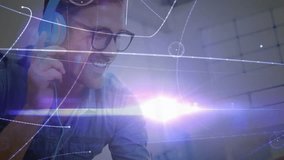 Creative pro tapping tablet launching floating AR visuals while donning headphones in workspace. Technology, innovation, futurism, digital, entertainment, expression, productivity - Powered by Shutterstock - Get 15% off with code: PIKWIZARD15