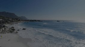 Camera panning over beach initiating candlestick chart overlay visualizing stock trends then fading. Finance, market, investment, trading, analytics, digital, technology - Powered by Shutterstock - Get 15% off with code: PIKWIZARD15