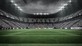 Floodlights glowing lighting turf as snowflakes drifting swirling accumulating on yellow goalposts. Stadium, winter, sports, illumination, foggy, atmospheric, action - Powered by Shutterstock - Get 15% off with code: PIKWIZARD15