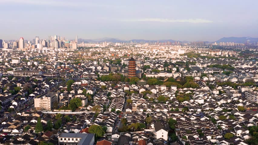 Aerial view of Suzhou Gusu City, Jiangsu Province showing traditional architecture, rooftops, gardens and a pagoda